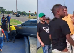 Capturas de video que captó el momento en el que el futbolista es reducido por un grupo de hombres y abordado por agentes de tránsito.