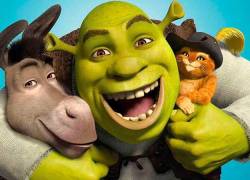 Imagen en que aparece el célebre trío de la saga de fantasía, Burro, Shrek y el Gato con Botas.