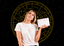 Mujer con calendario en la mano pensando las fechas zodiacales más importantes.