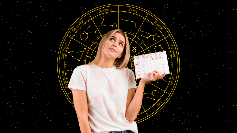 Mujer con calendario en la mano pensando las fechas zodiacales más importantes.