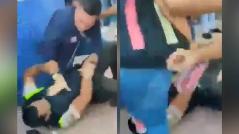 Video capta cómo una mujer le pisa la cabeza a un policía durante una riña en Libertad